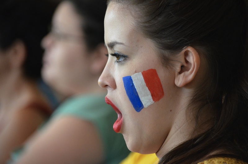 French teenager cheering the national football team