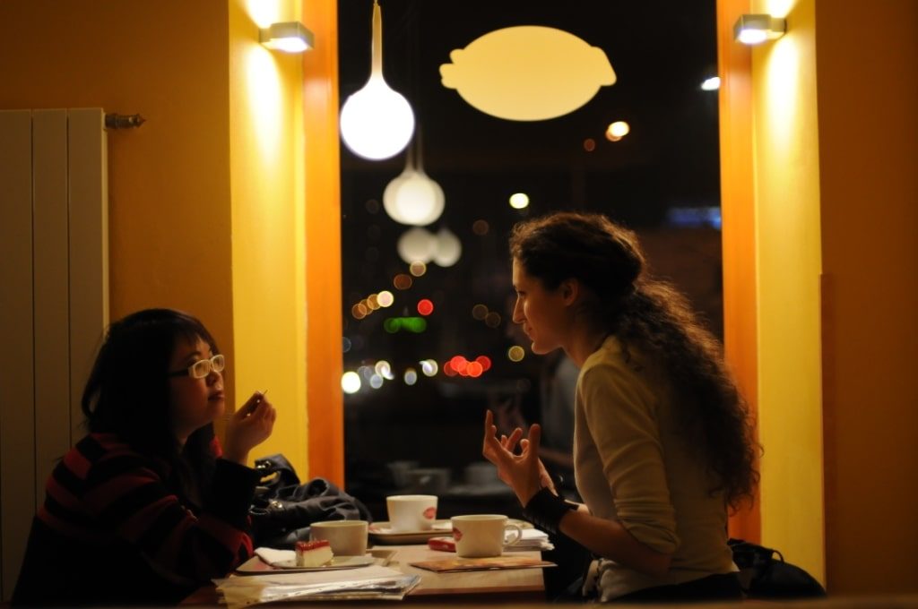 two women speaking in spanish