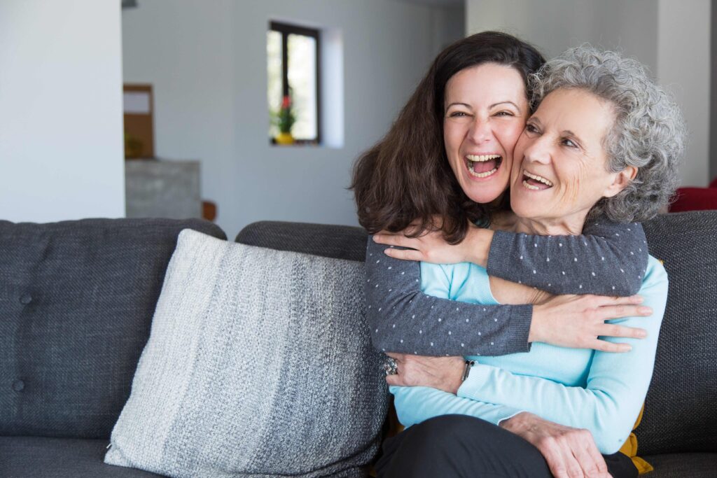 Young woman hugging her mother and using Spanish nicknames