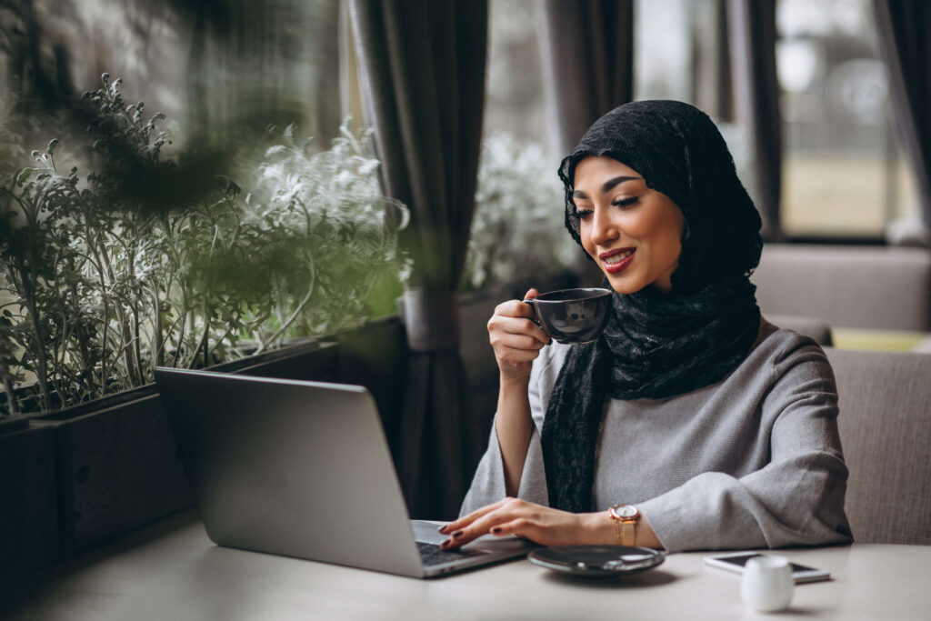 Woman in hijab learning Arabic with quotes