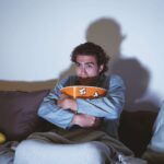 man-hugging-popcorn-watching-movie-min-150x150.jpg