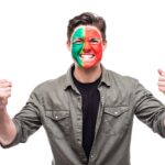 handsome-man-supporter-fan-portugal-national-team-painted-flag-face-get-happy-victory-screaming-into-camera-fans-emotions-min-150x150.jpg