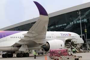 Thai Airways plane being loaded at an airport